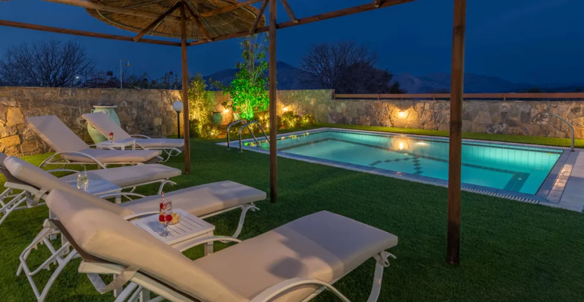 Treasure of Herbs complex: Poolside, loungers area by night