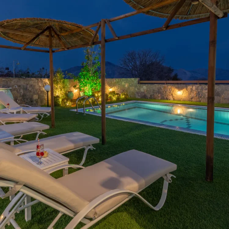 Treasure of Herbs complex: Poolside, loungers area by night