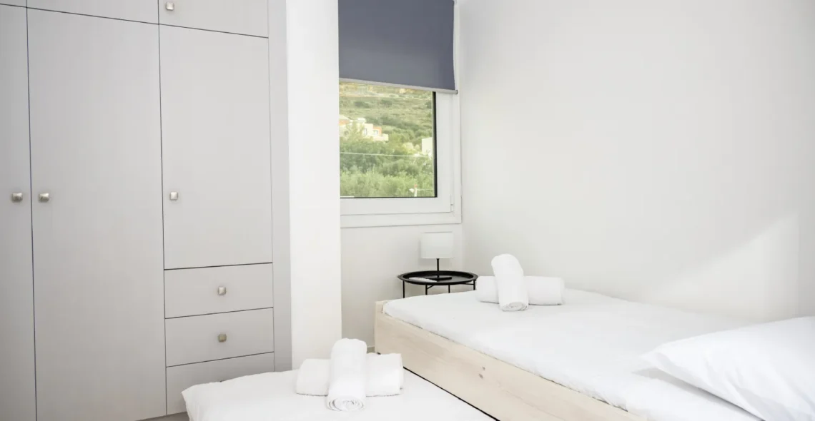 Athinais Suites A2: Second bedroom that can transform to a 2 visitor bedroom